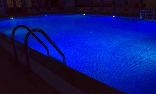 A heated pool at night